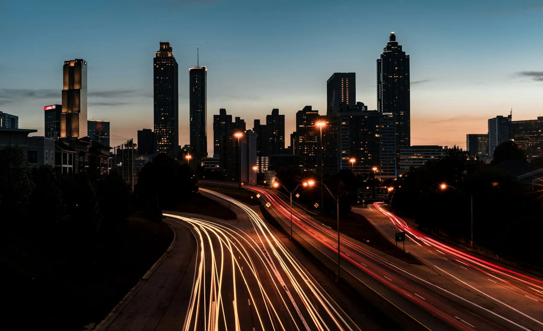 A city skyline at blue hour, representing urban-market exposure.